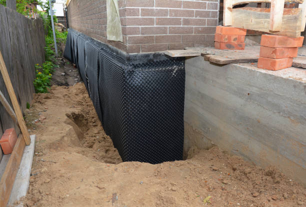 SJ Waterproofing Pros technician performing targeted Interior Drainage System assessment in Delaplane, VA